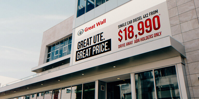 Price signage on the side of a Great Wall Motors dealership, designed by MOO Marketing & Design