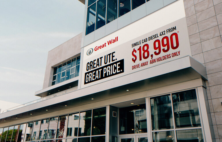 Outdoor advertising on Great Wall Motors dealership wall, designed by MOO Marketing & Design graphic design agency in Melbourne