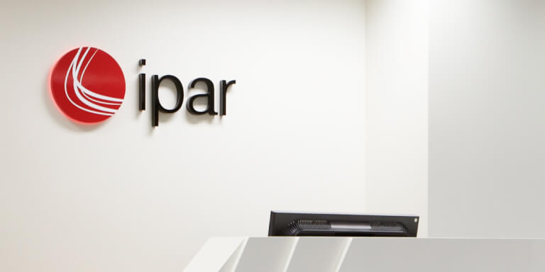 IPAR company logo mounted to wall in a reception area