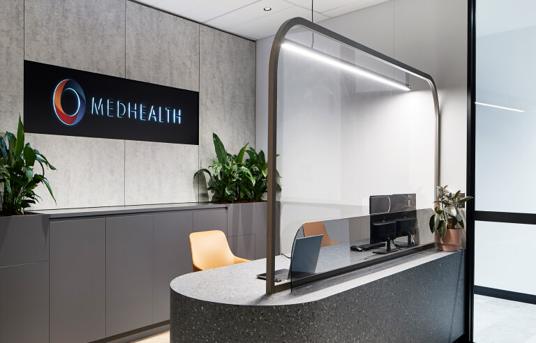 Medhealth reception area with wall signage designed by MOO Marketing & Design