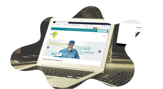 Photo of a laptop showing the atWork website